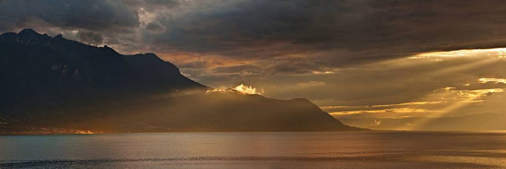 Lake Geneva after storm. Picture taken from Montreux, on the left side in the rays of light - Saint-Gingolph.