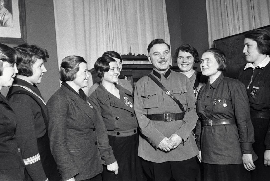 Kliment Voroshilov at a meeting with young Communist League members”. USSR Commissar of Defense Kliment Voroshilov (fourth right) has a meeting with Young Communist League female members awarded an honorary title 